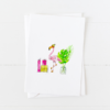 Cute pink flamingo doodle wearing a knit cap next to holiday gifts, pointed flap envelope