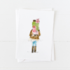Holiday shopper holding gifts Christmas card with pointed flap envelope